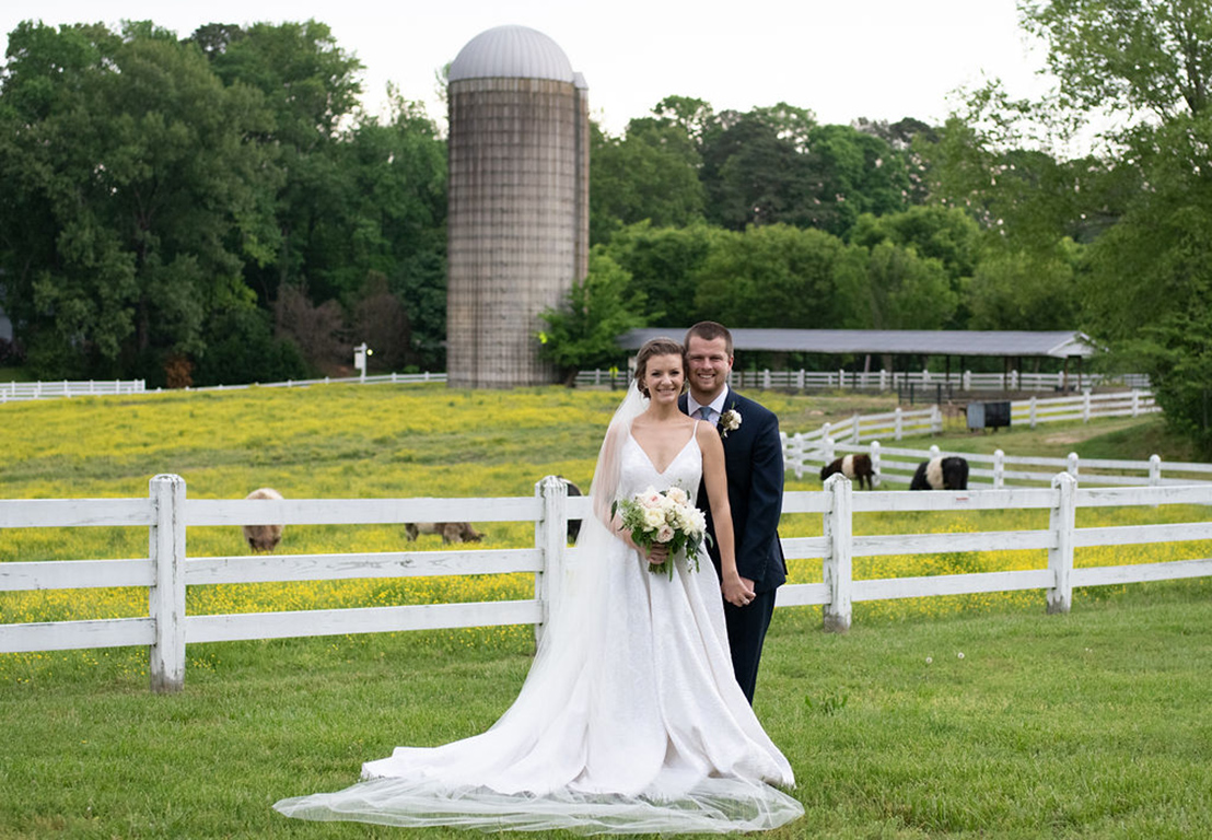 Erin and Brandon wedding portrait in a field