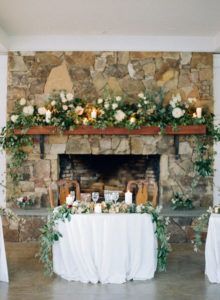 flowers draping the fireplace on the garden terrace at fearrington